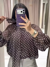 Sofia blouse a pois con collo alto
