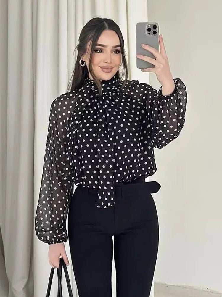Sofia blouse a pois con collo alto